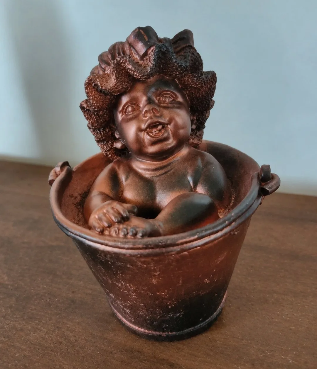 Tirelire bébé dans son bain